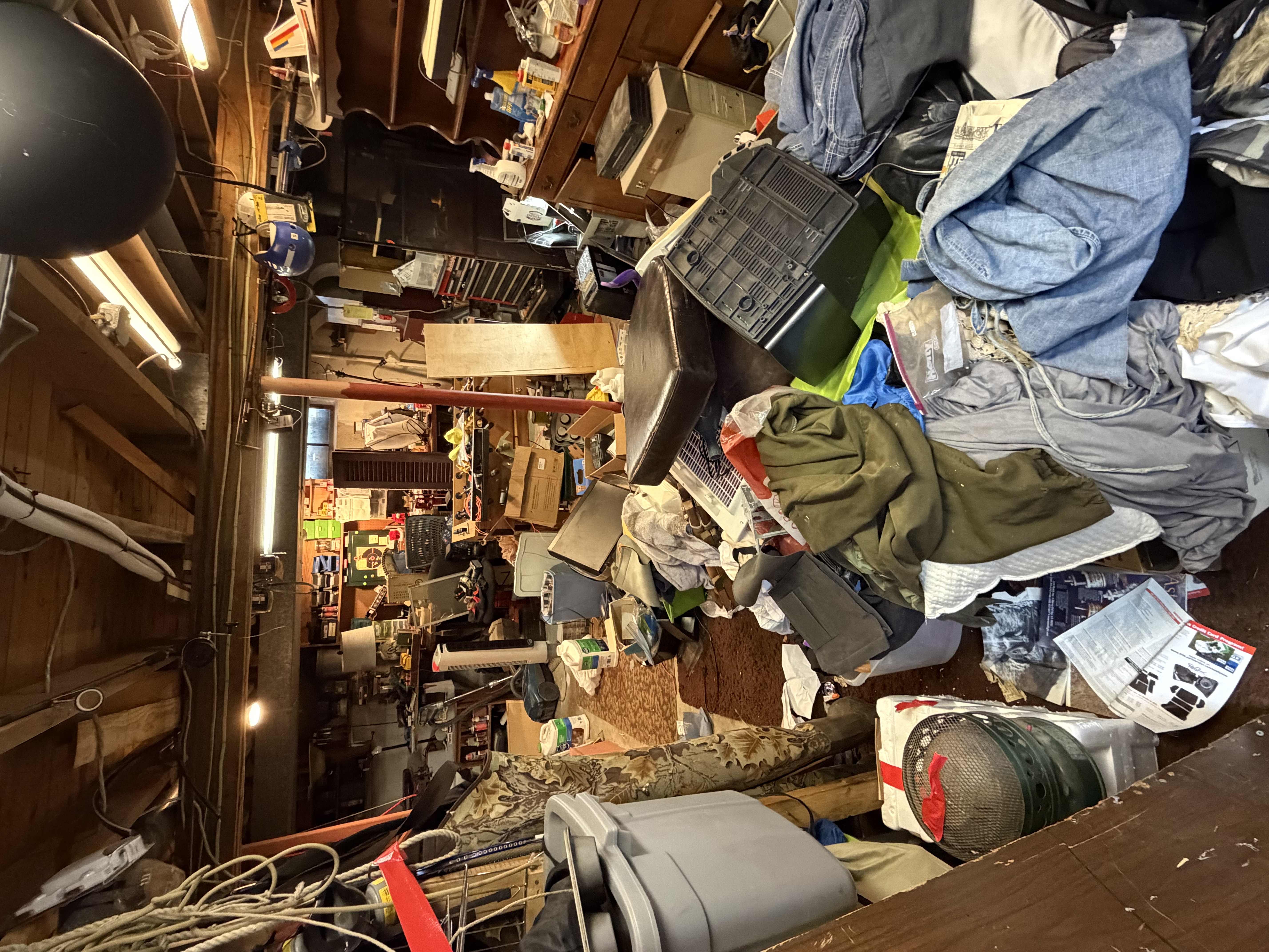 Cluttered basement before cleanout